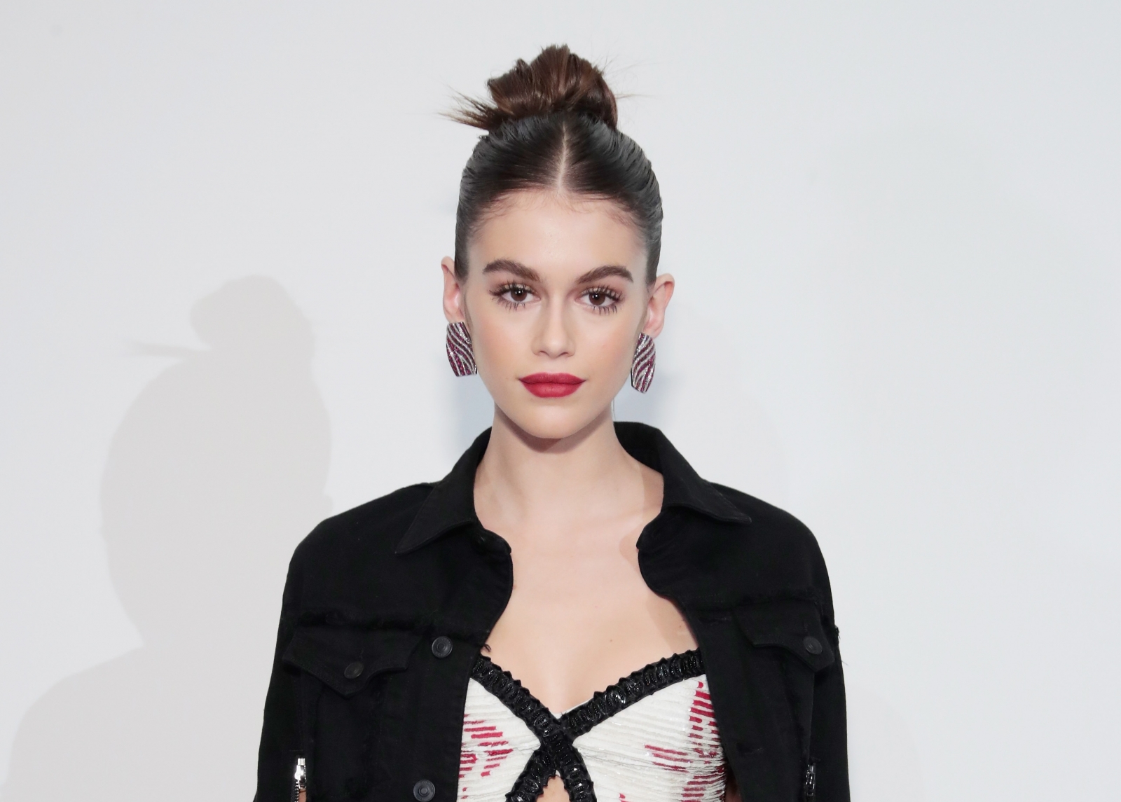 Cindy Crawford's teenage daughter Kaia stuns in orange swimsuit on