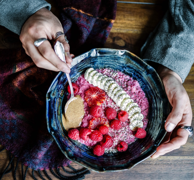 Pink porridge with bananas and raspberries