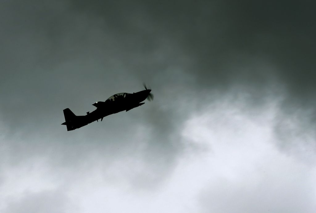 Light attack aircraft from dirt airstrip Light attack aircraft from dirt airstrip