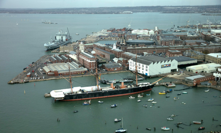 Two sisters have been jailed for smuggling seven Albanians into the UK at Portsmouth dock in a camper van that smelled “unbearable”