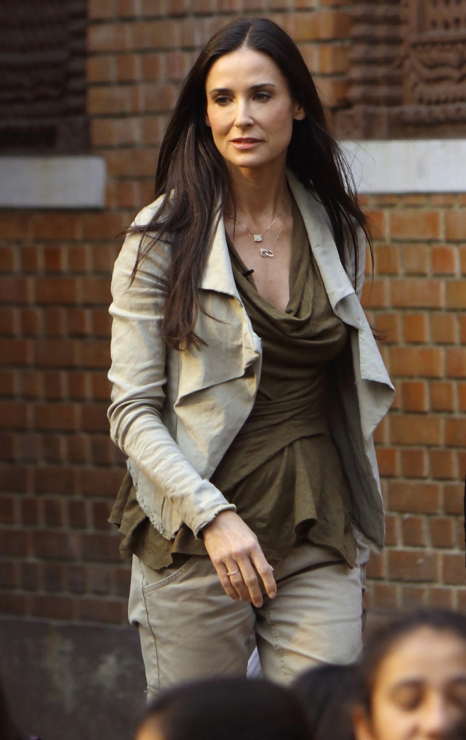 Actress Demi Moore arrives for a news conference in Kathmandu