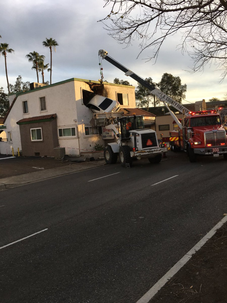 Car wedged building