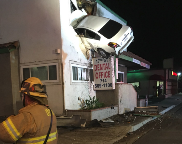 Dramatic image shows car wedged into the top floor of ...