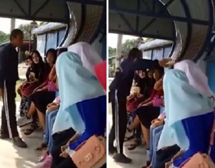 Woman slapped for not wearing hijab