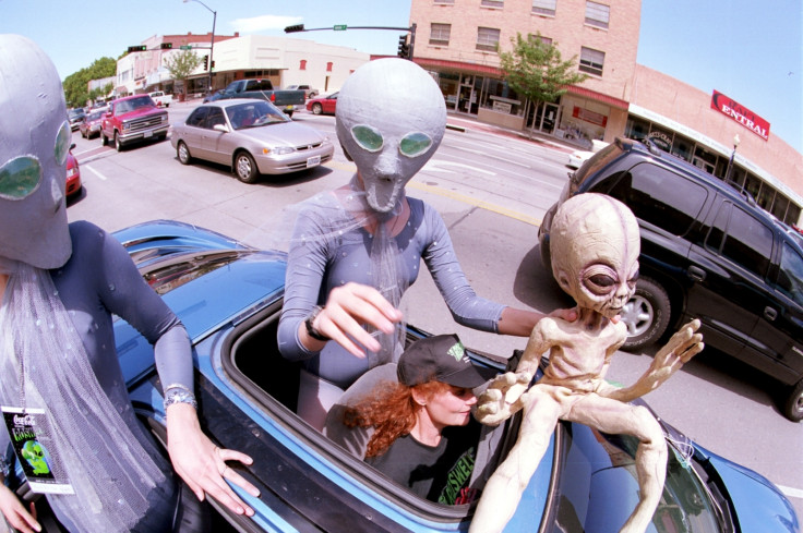 People dressed as aliens