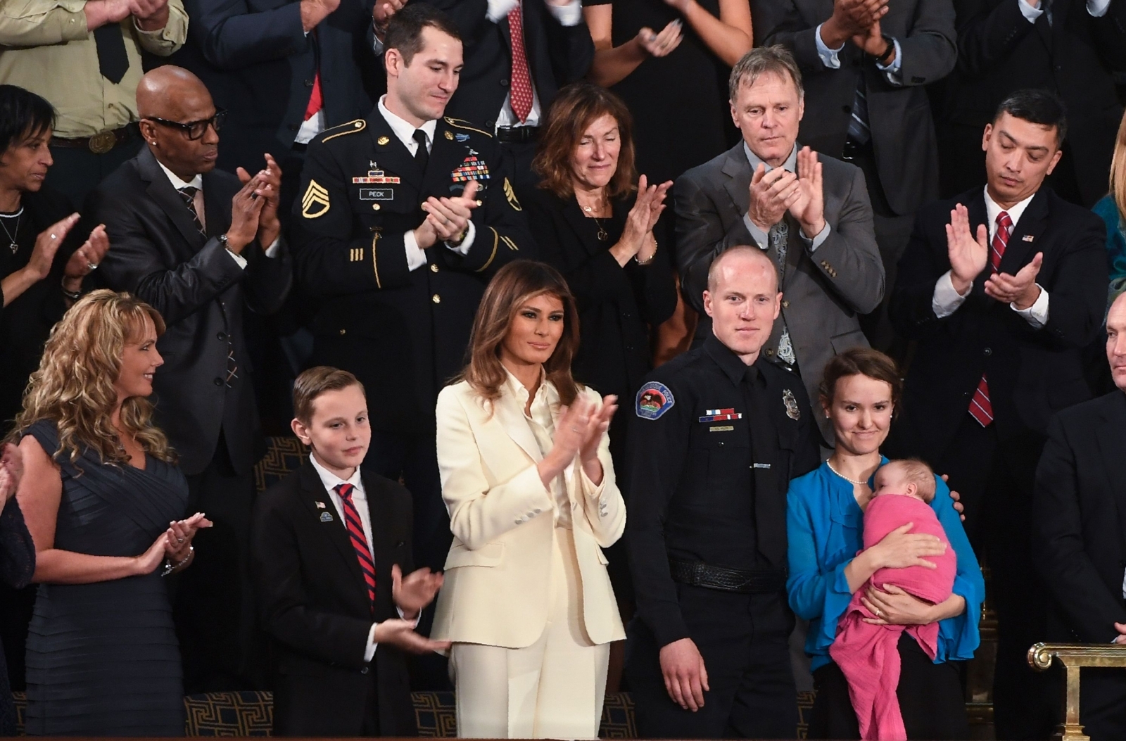 Double Barron: Trumps ribbed for 'recasting' son as Melania sits next to lookalike at ...
