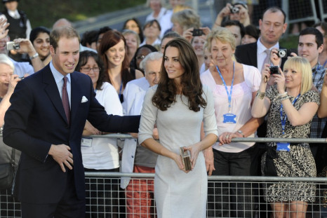 Britain's Prince William and his wife Catherine, Duchess of Cambridge leave after a visit to the Royal Marsden hospital in Sutton, southern England 29/09/2011