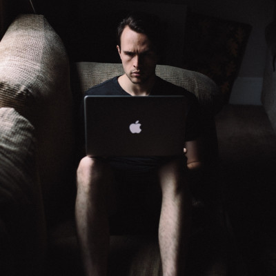 Man on a laptop in the dark
