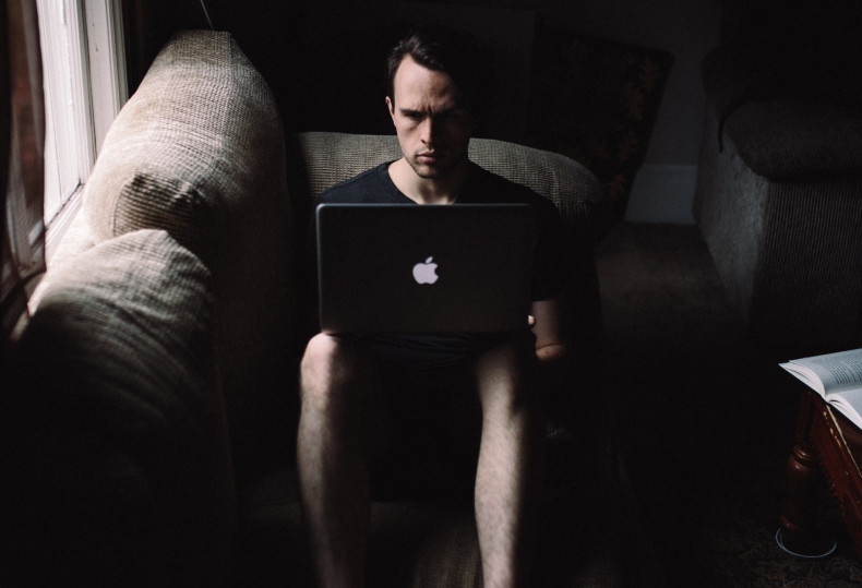 Man on a laptop in the dark