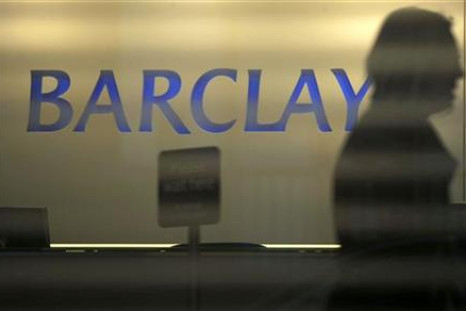A customer enters a branch of Barclays bank in London