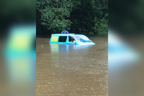 British Backpackers Wake Up To Find Van Partially Submerged By Floodwaters