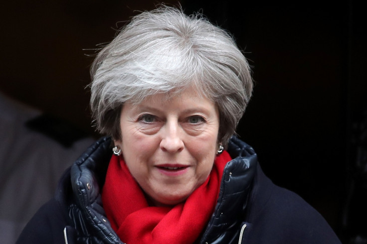 Theresa May leaves Downing Street for PMQs