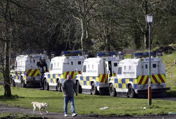 Man walks past Northern Irish police