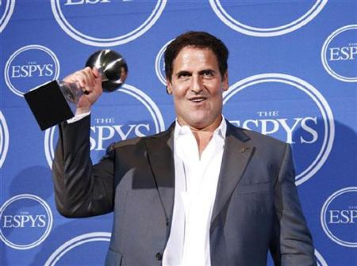 Dallas Mavericks billionaire owner Mark Cuban holds the ESPY Award for &quot;Best Team&quot; after his team won the honor at the 2011 ESPY Awards in Los Angeles