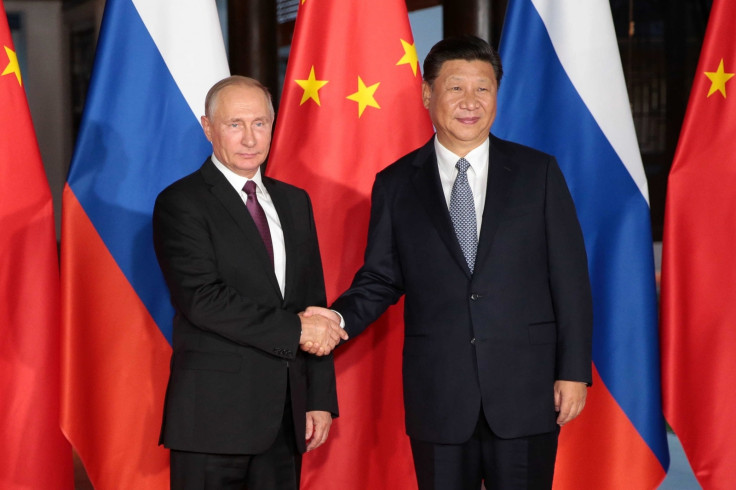 Vladimir Putin with Xi Jinping