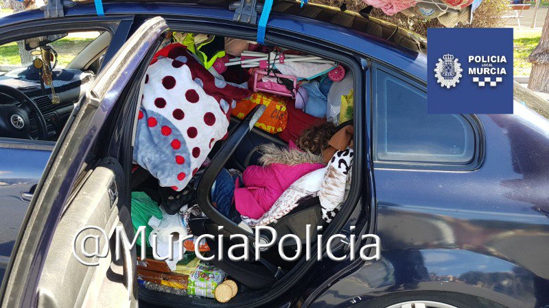 Sleeping girl in overladen car Sleeping girl in overladen car
