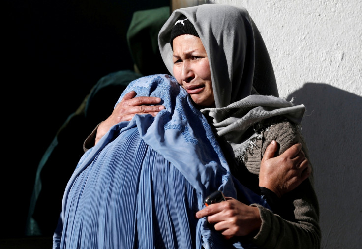 Afghan women mourn inside a hospital
