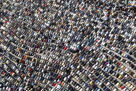 Anti-government protesters take part in Friday prayers at Tahrir Square in Cairo