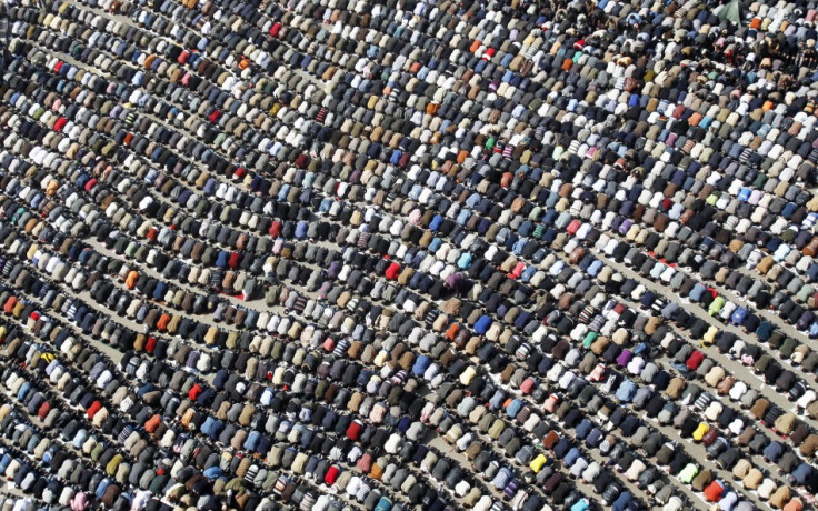 Anti-government protesters take part in Friday prayers at Tahrir Square in Cairo