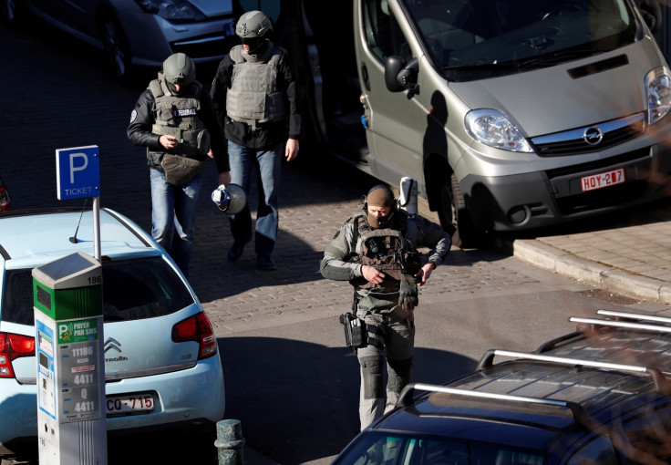 Specialist armed units prepare to surrounded a building in the Belgian capital, where a gunman, or gunmen are holed up