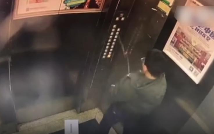 Chinese boy peeing on elevator buttons