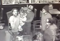 Man holds daughter during bar fight Man holds daughter during bar fight