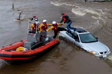 Dramatic Timelapse Shows Motorist Rescued From Car Roof In California Flood