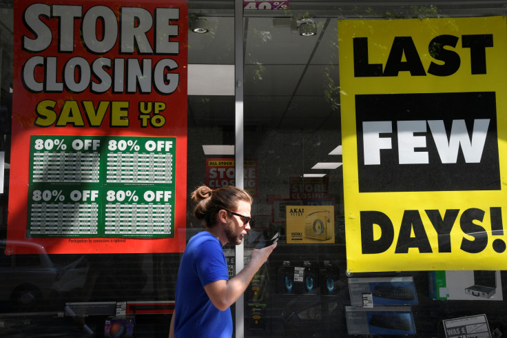 Closing down signs hang in store's window