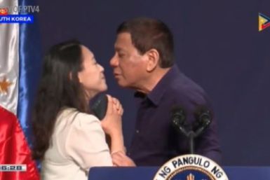 Philippine President Duterte kisses woman