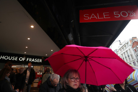 Shoppers walk past House of Fraser 