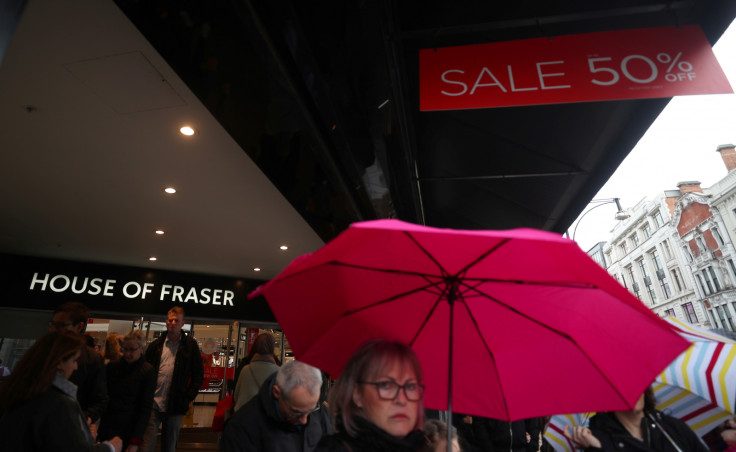 Shoppers walk past House of Fraser 