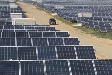 A car drives along the territory of a solar energy power station near the Okhotnikovo village in the Crimea's Saksky district