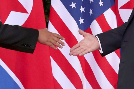 Trump shakes hands with Kim Jong Un 