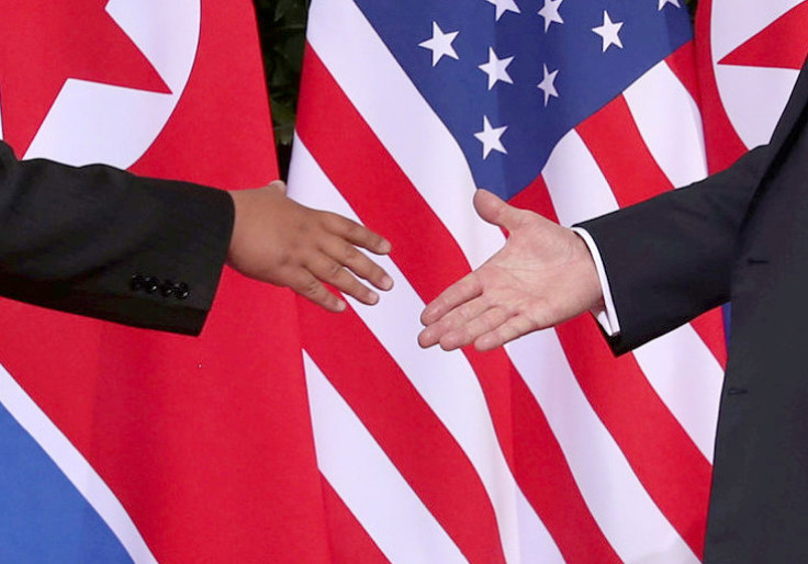 Trump shakes hands with Kim Jong Un 