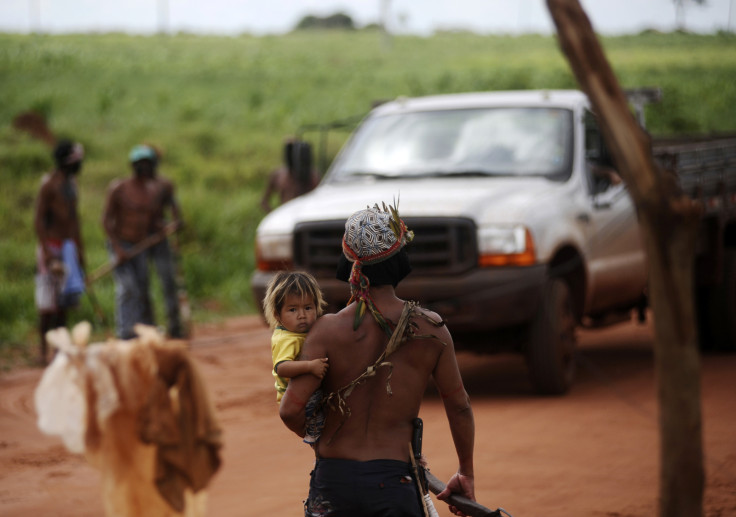 Guarani Nandeva Indians stop a farmer