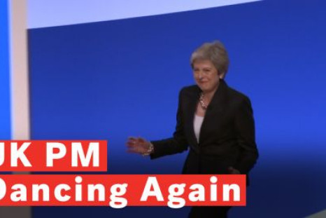 Theresa May dancing