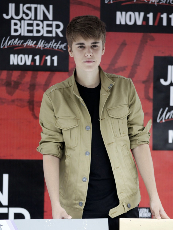 Canadian pop singer Justin Bieber poses during a photocall at the Foro Sol before his &quot;My World Tour&quot; concert in Mexico City