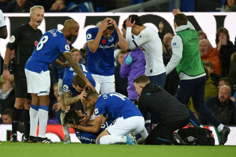 Everton players comfort Andre Gomes