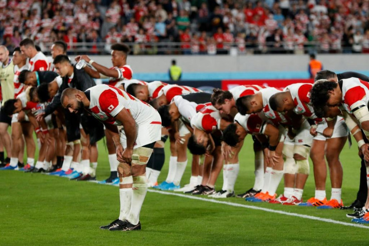 Japan captain Michael Leitch leads his team 