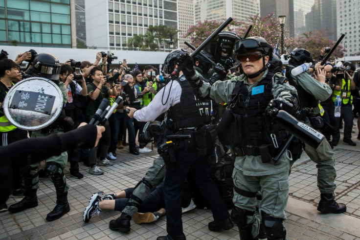 Riot police break rally for Uighur Muslims