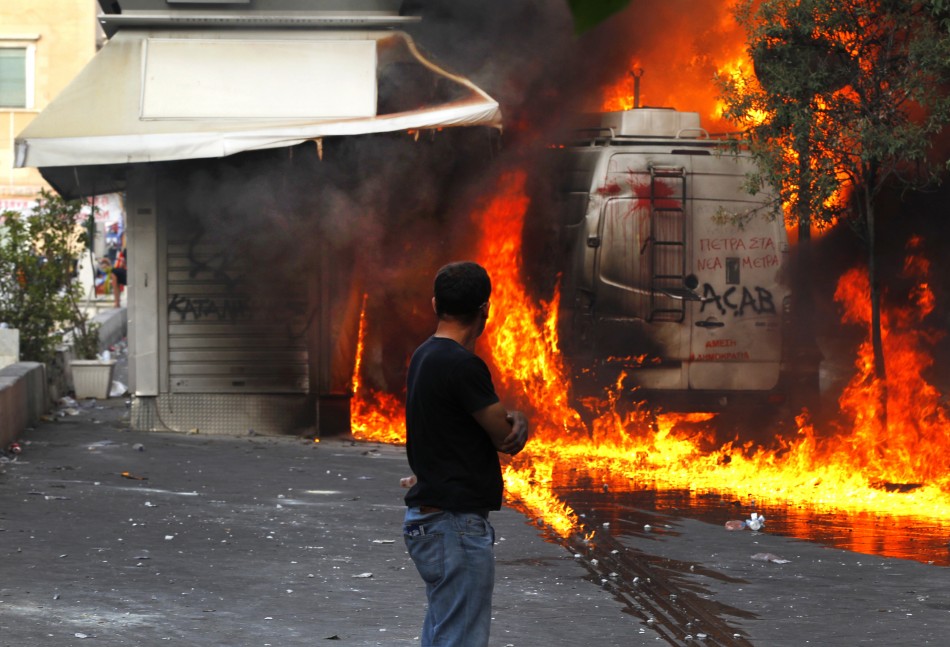 File photo of the kiosk of Dimitris Ptohos burning during riots in Athens