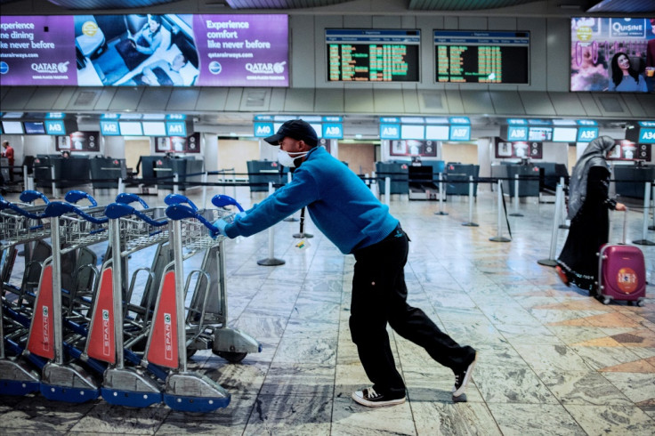 Airport employee wears mask