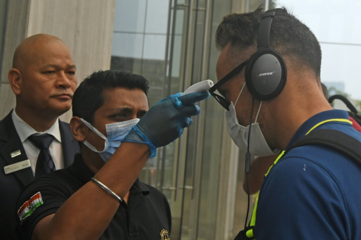 Hotel staff check temperature of cricketer