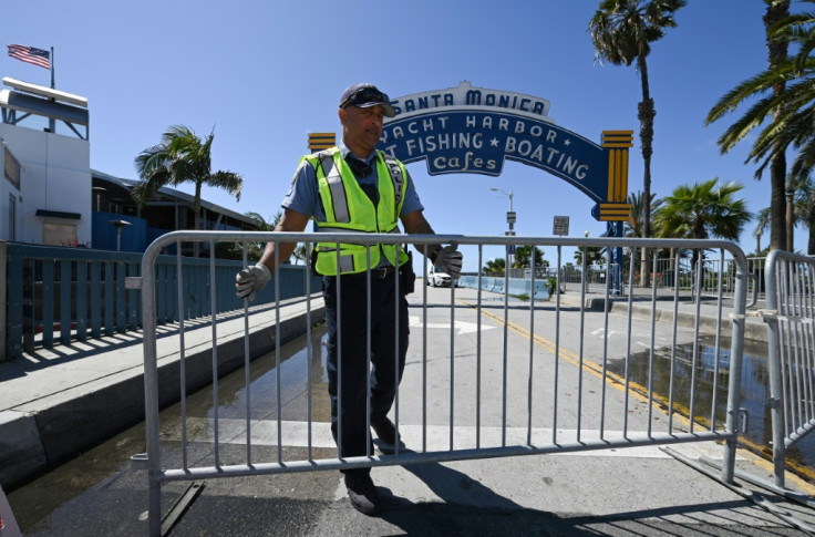 A police officer closes access to Santa Monica pier 