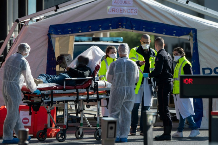 Doctors tend to patient in Paris hospital