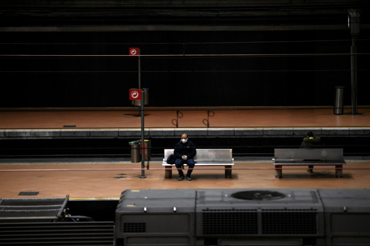 Man sits on a platform in Madrid