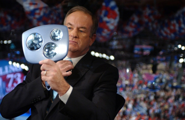 Commentator Bill O Reilly checks himself in mirror before interview at Republican National Convention.