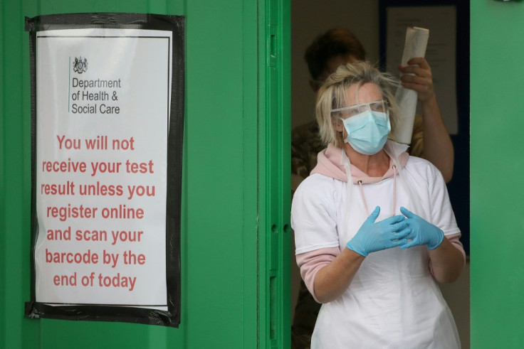 A medical worker prepares to test key workers