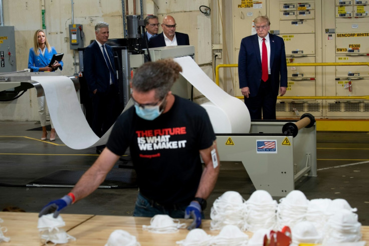 Trump watches workers making masks at Honeywell