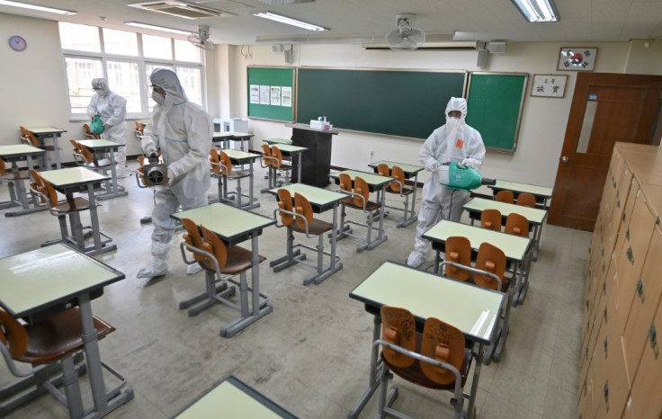 Health officials wearing protective gear 